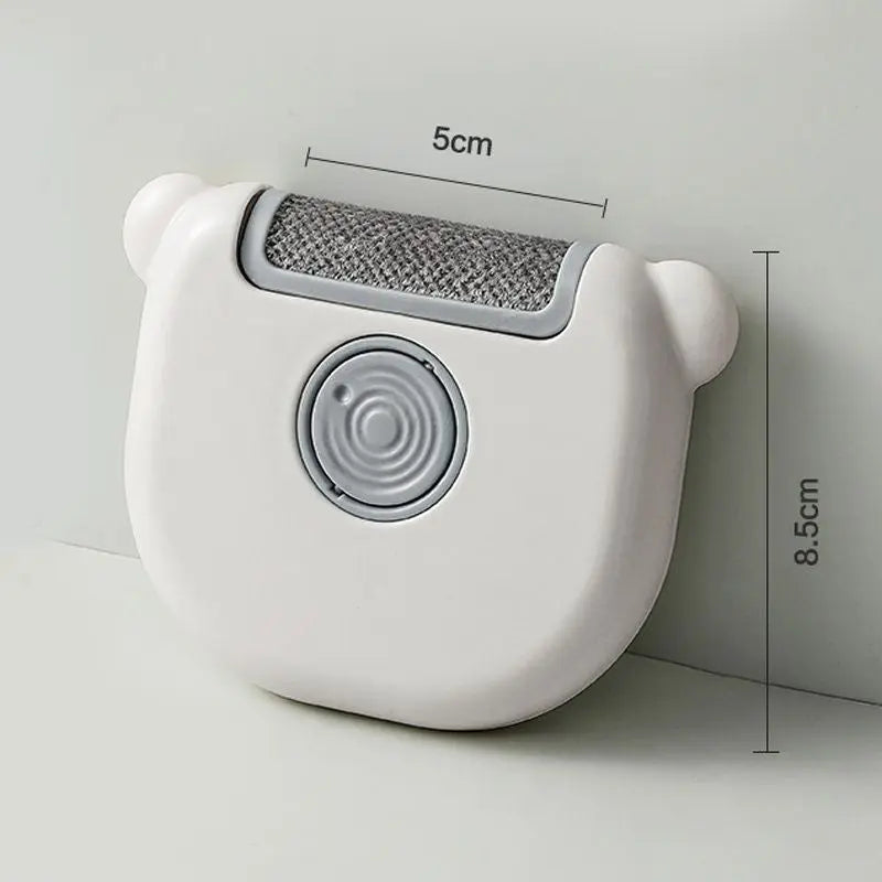 Green Noblias portable pet hair lint remover brush for clothes and furniture, with a compact design and ergonomic handle.