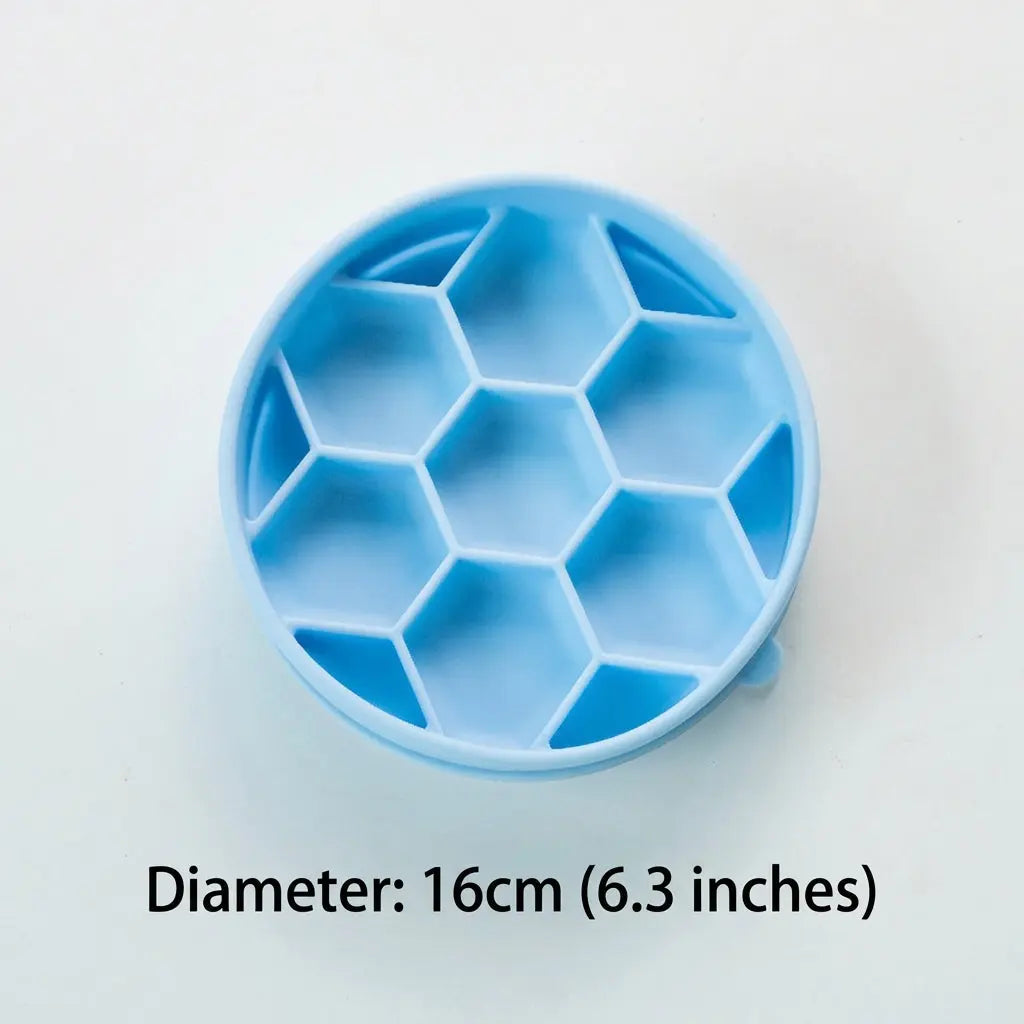 Top view of the empty blue Noblias honeycomb slow feeder dog bowl, showing the raised hexagonal walls that divide it into separate cells.