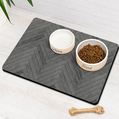 Charcoal herringbone absorbent pet feeding mat with a water bowl and a food bowl of kibble.