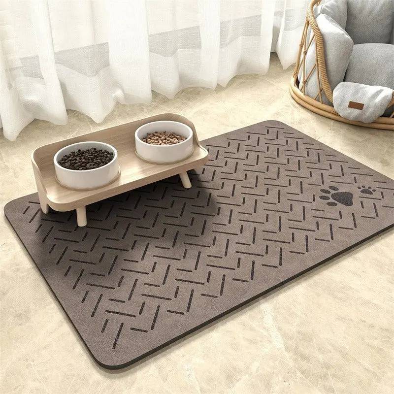 Taupe chevron absorbent pet feeding mat with a small paw print in the corner under a raised double bowl.