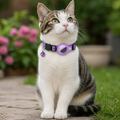 Tabby cat in the garden wearing the purple AirTag cat collar with the tracker holder at its throat
