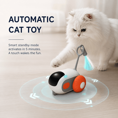 White cat pawing at the orange automatic cat toy car with a feather tail, captioned that standby mode activates in five minutes and a touch wakes it.