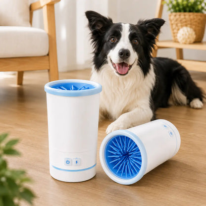 White Noblias automatic dog paw cleaner cup beside a border collie, with the blue silicone brush ring visible inside.