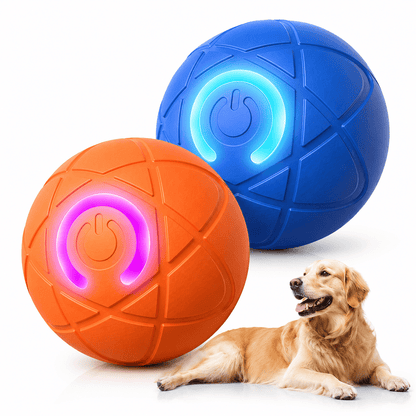 Noblias automatic moving dog ball in blue and orange with the LED ring lit, and a Golden Retriever watching in the background