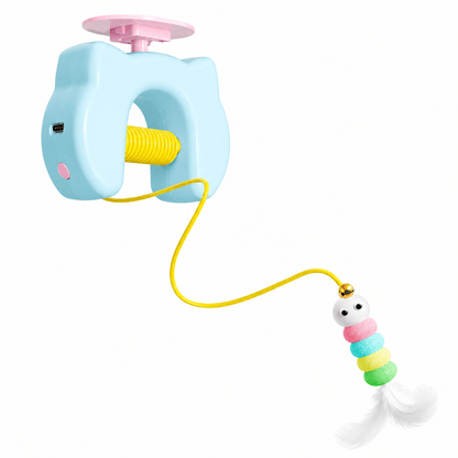 The blue Noblias automatic yo-yo cat toy with its ceiling mount, coiled spring body and beaded feather teaser on an elastic rope.