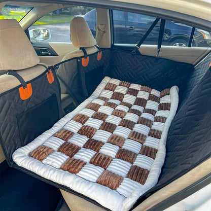 The Noblias back seat dog bed mat in the brown check style, laid across the rear seat.