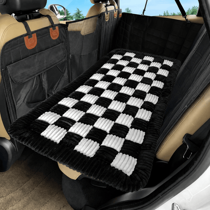 The Noblias back seat dog bed mat in the white small check style, fitted across a rear bench.