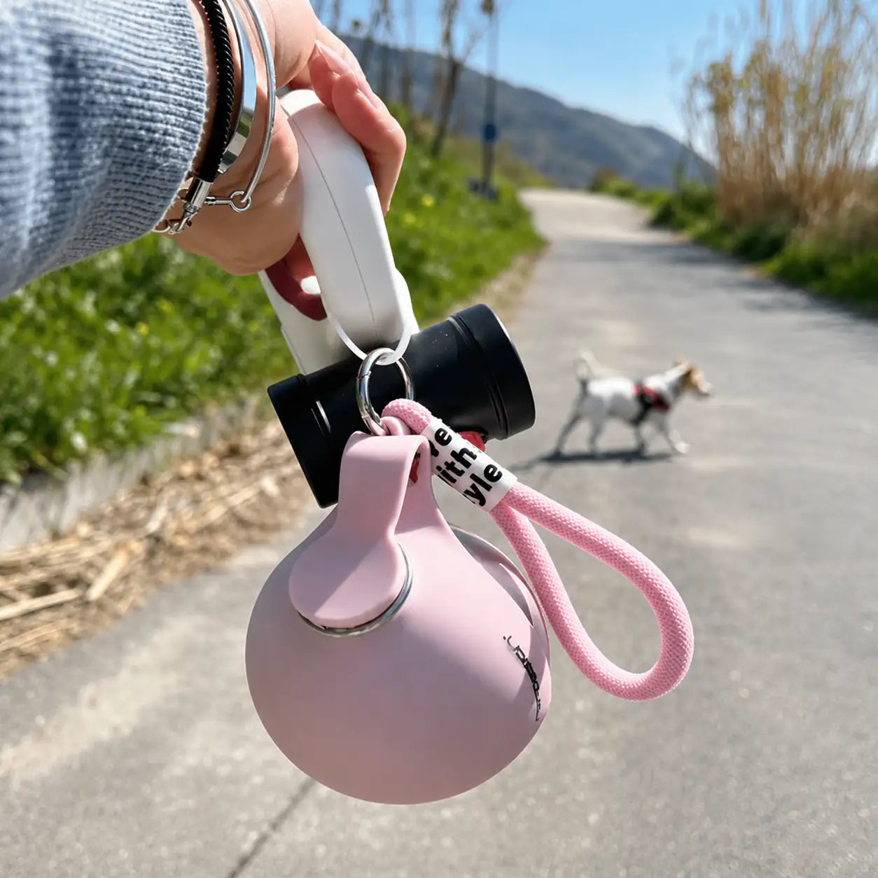 Blue Noblias portable dog water bottle with leak-proof design and integrated bowl for easy hydration during travel.