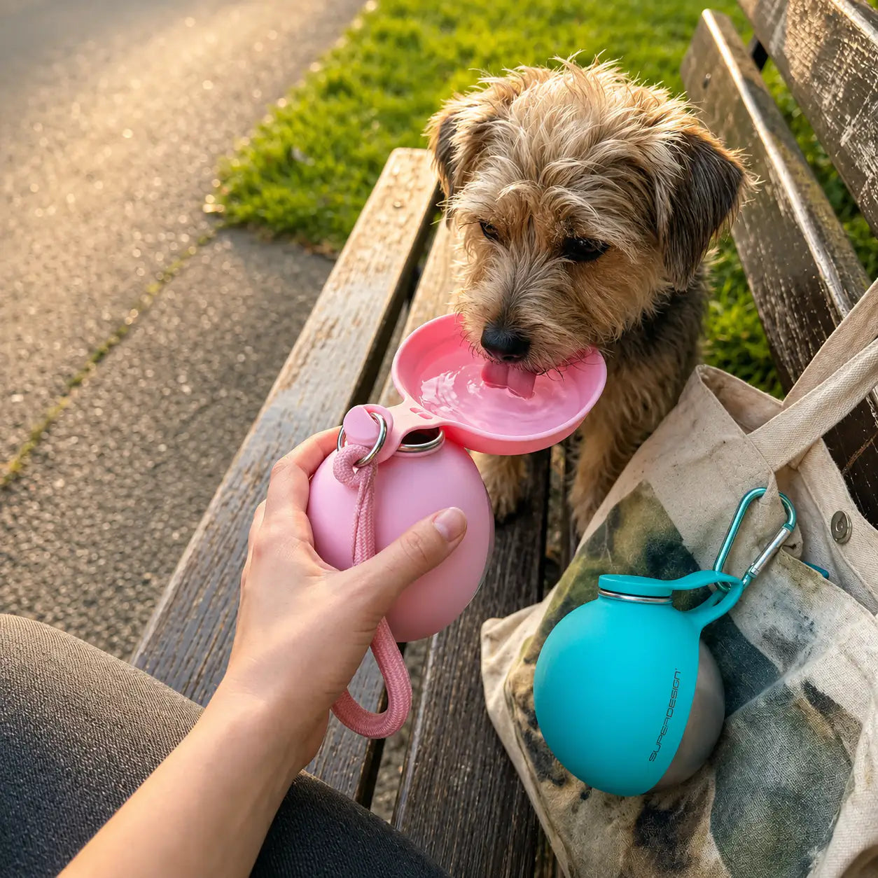 Blue Noblias portable dog water bottle with leak-proof design and built-in bowl for easy hydration during travel.