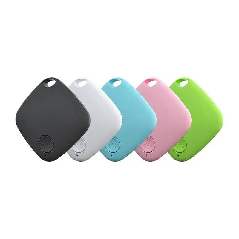 Five Bluetooth pet trackers in black, white, blue, pink and green, each a rounded square tag with a keyring hole.