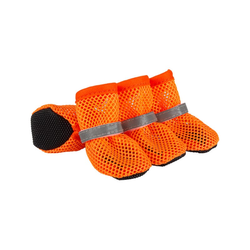 Set of four orange breathable mesh dog shoes with grey reflective straps and black rubber soles on a white background.