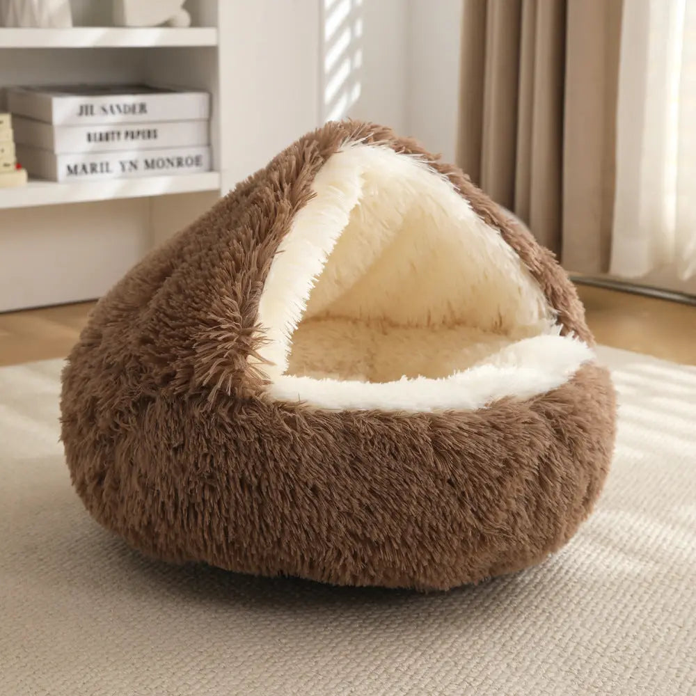 Coffee brown Noblias calming hooded cave pet bed with a cream faux fur lining inside the hood.