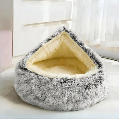 Khaki gray Noblias calming hooded cave pet bed with the plush hood raised over the sleeping space.