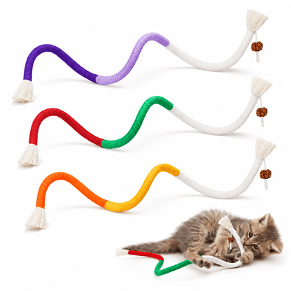 Purple, orange and red-green cat chew rope toys laid out with a kitten chewing the end of one