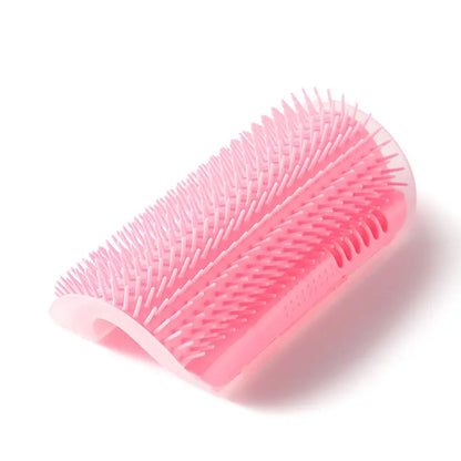 Pink cat corner self groomer on a white background.