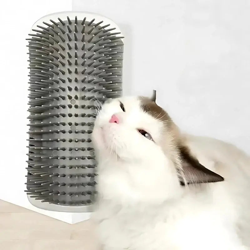Ragdoll cat rubbing against the gray cat corner self groomer mounted on a wall corner.
