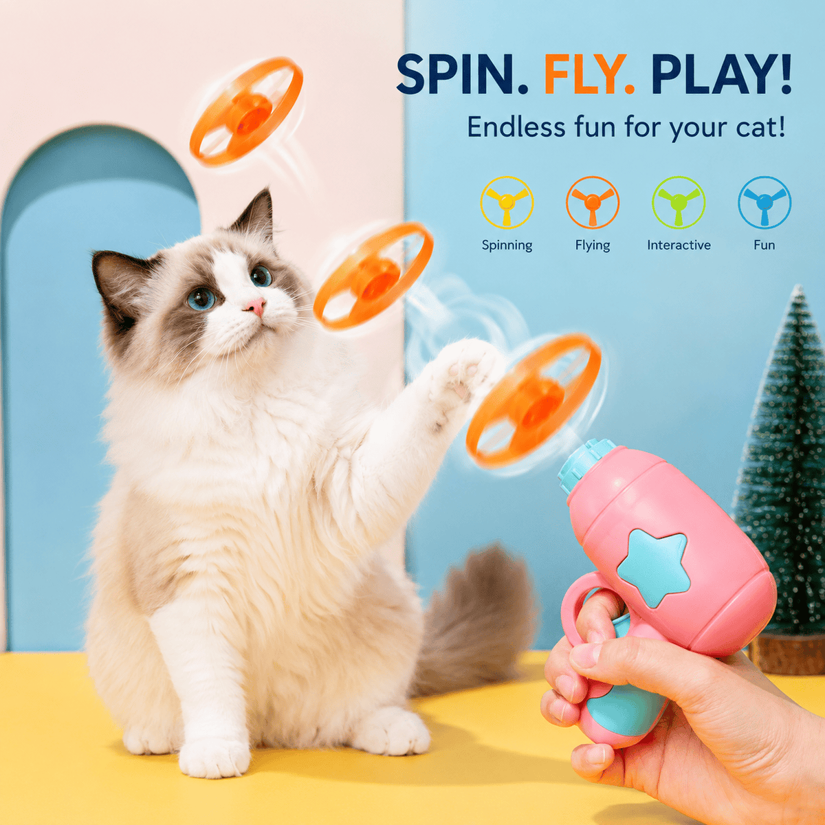 Ragdoll cat reaching up to bat at orange discs in mid-air launched from the pink cat disc launcher, with spin fly play text