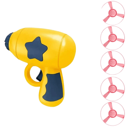 Yellow cat flying disc launcher with a navy star and grip, shown with a stack of pink spinning discs