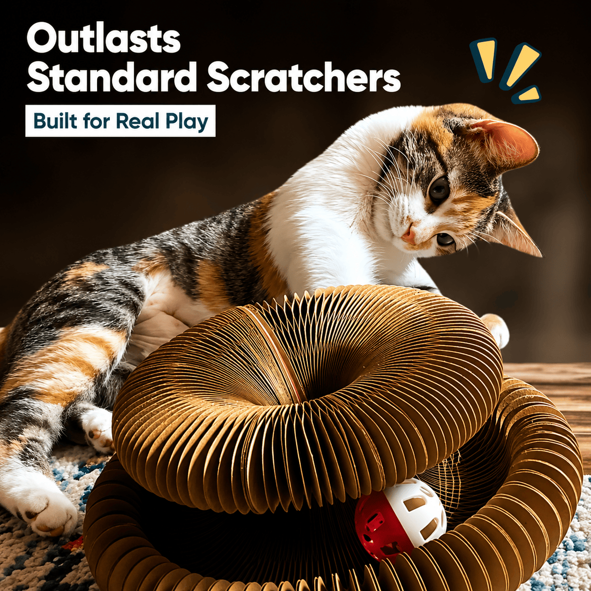 Calico cat lying across the stretched-out cardboard scratcher with the bell ball in the track, under a banner reading outlasts standard scratchers, built for real play