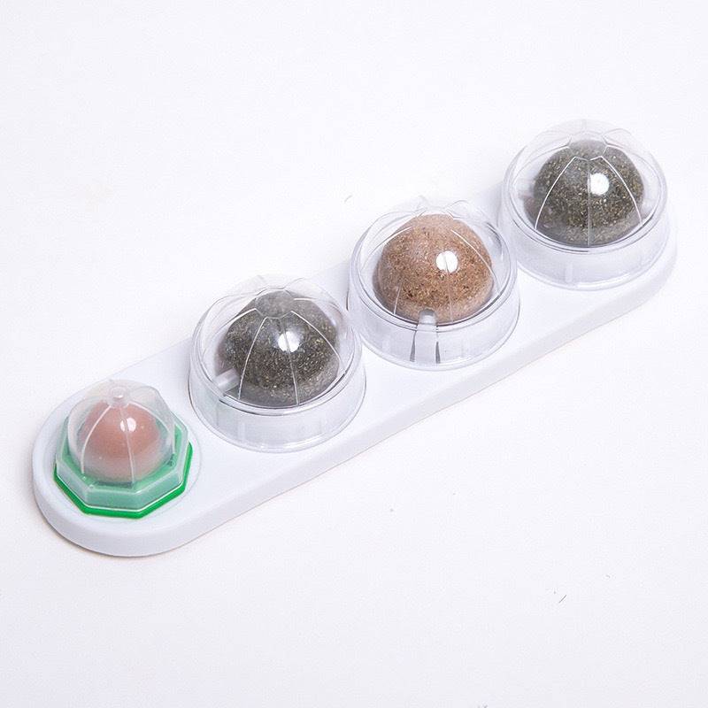 White Noblias catnip wall ball rail with its four rotating treat balls.
