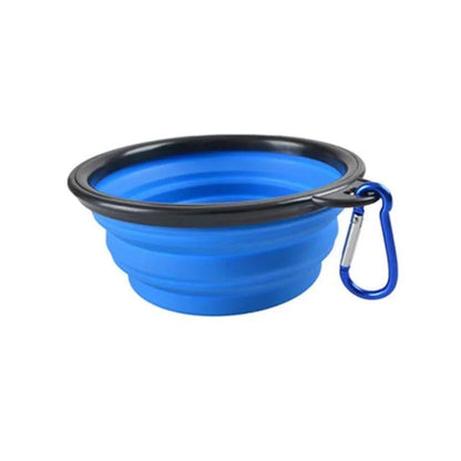 Blue Noblias collapsible silicone travel bowl with a blue carabiner clip.