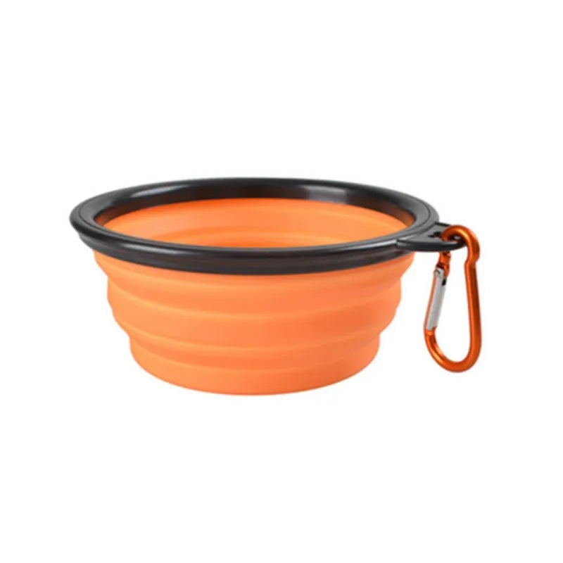 Orange Noblias collapsible silicone travel bowl with an orange carabiner clip.