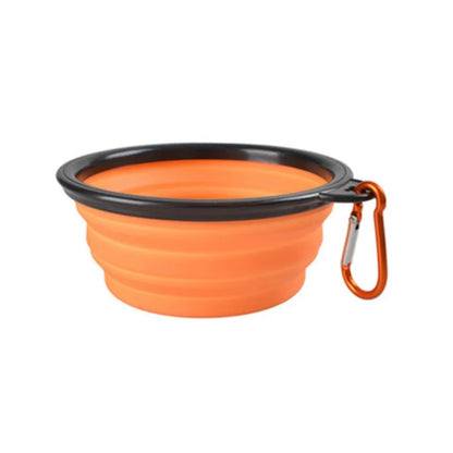 Orange Noblias collapsible silicone travel bowl with an orange carabiner clip.