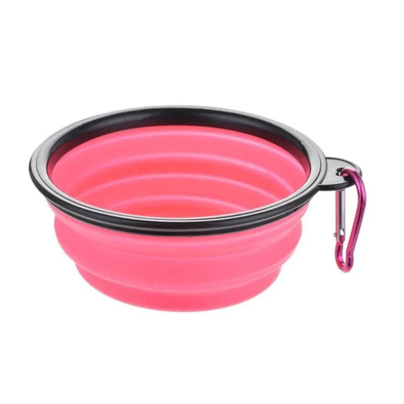 Pink Noblias collapsible silicone travel bowl with a matching pink carabiner clip.