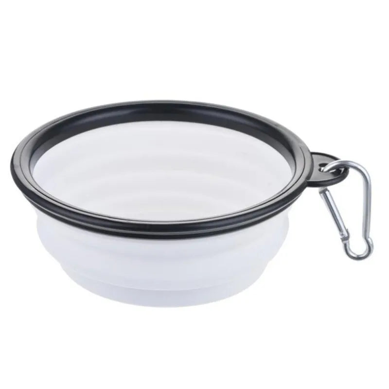 White Noblias collapsible silicone travel bowl with a silver carabiner clip.