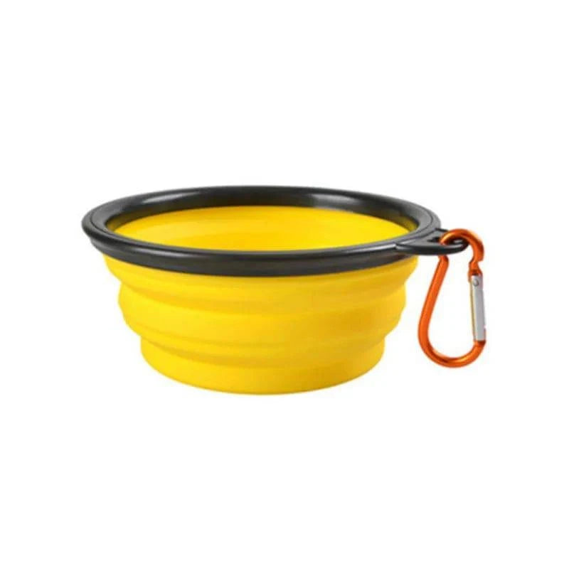 Yellow Noblias collapsible silicone travel bowl with an orange carabiner clip.