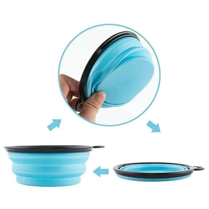 The Noblias collapsible silicone travel bowl being pressed flat and popped back open by hand.