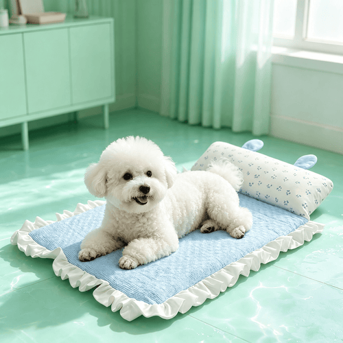 Bichon lying on the blue Noblias cooling pet mat with its frilled edge and rabbit ear bolster pillow.