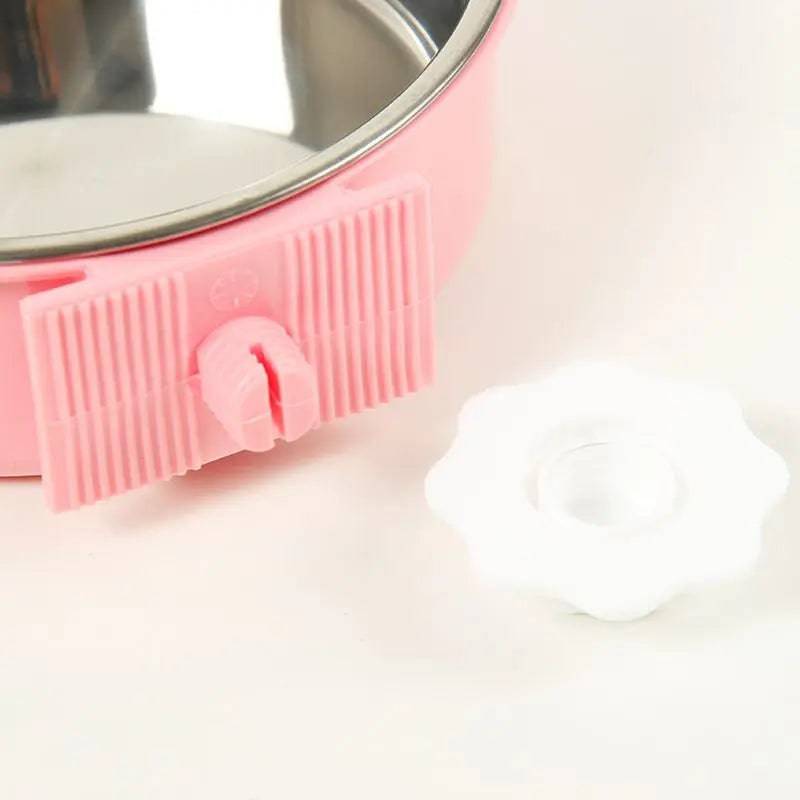 Close-up of the pink bracket and the white hexagon nut that screws on to lock the bowl to the cage wire