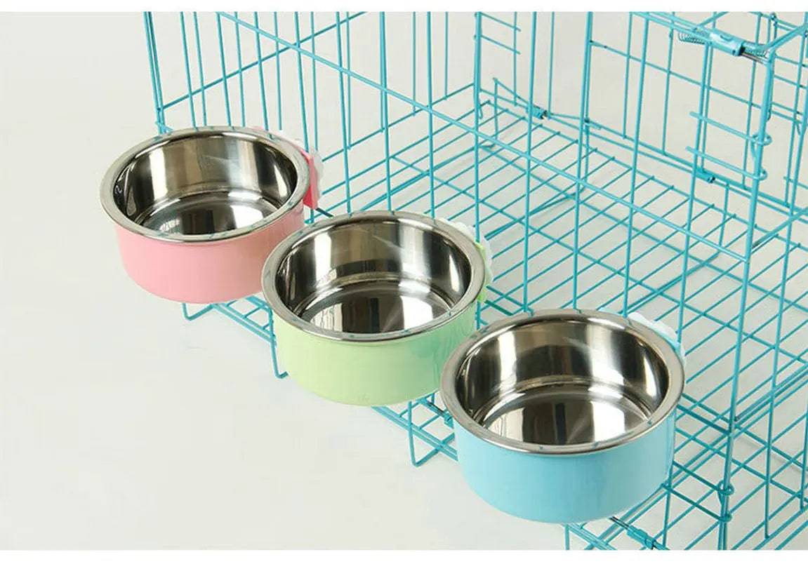 Product shot of all three crate bowl colors, pink, green and blue, each with its stainless steel inner bowl, mounted on a blue wire cage