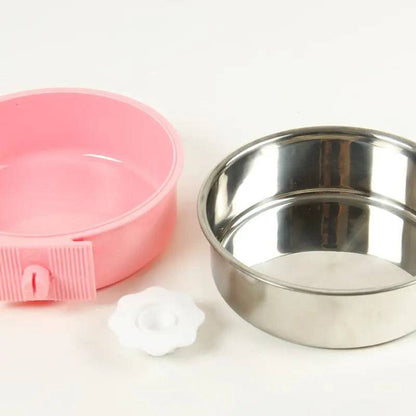 The crate bowl taken apart, showing the pink plastic outer holder, the stainless steel inner bowl that lifts out of it, and the white hexagon nut