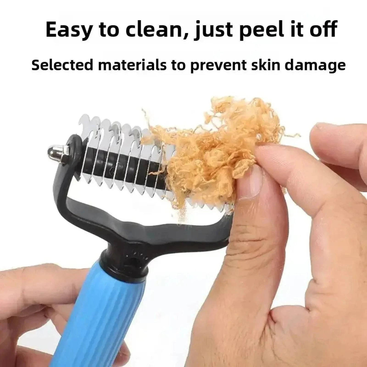 A hand peeling a mat of collected fur off the blades of the Noblias detangling comb in one piece.