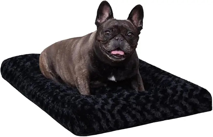 A french bulldog sitting on the black Noblias plush dog crate mat.