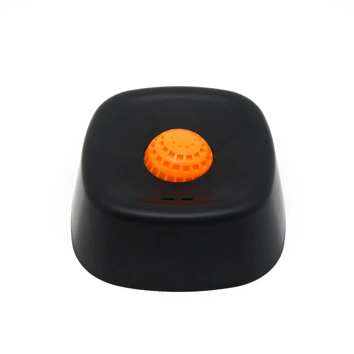 Black dog lick bowl with an orange rolling ball on a white background.