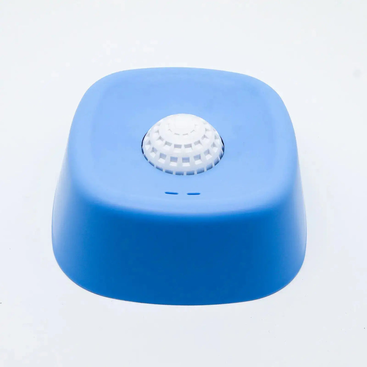 Blue dog lick bowl with a white rolling ball on a white background.