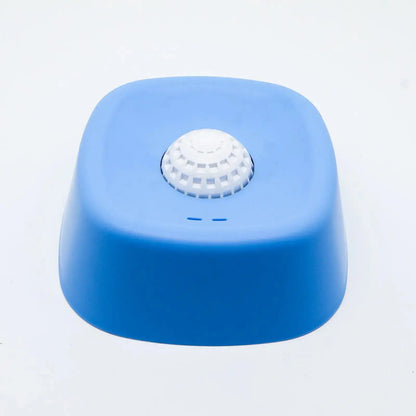 Blue dog lick bowl with a white rolling ball on a white background.