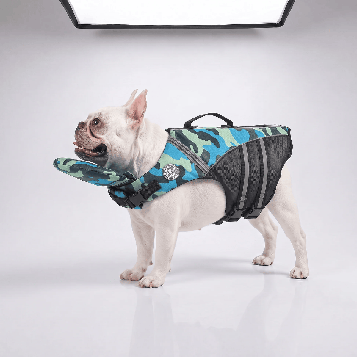 Blue camo dog life jacket shown on a French Bulldog against a plain studio background