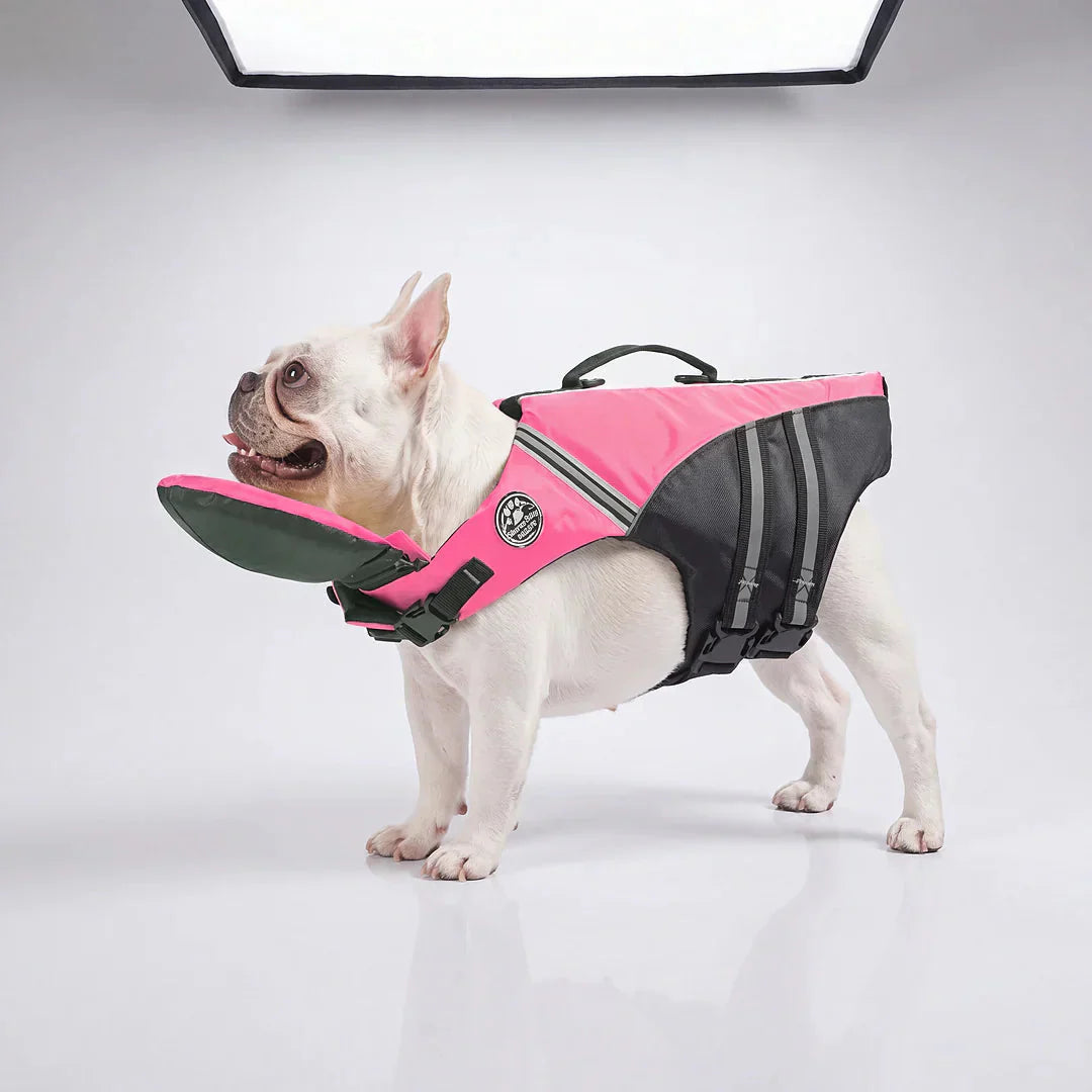 Pink camo dog life jacket shown on a French Bulldog against a plain studio background