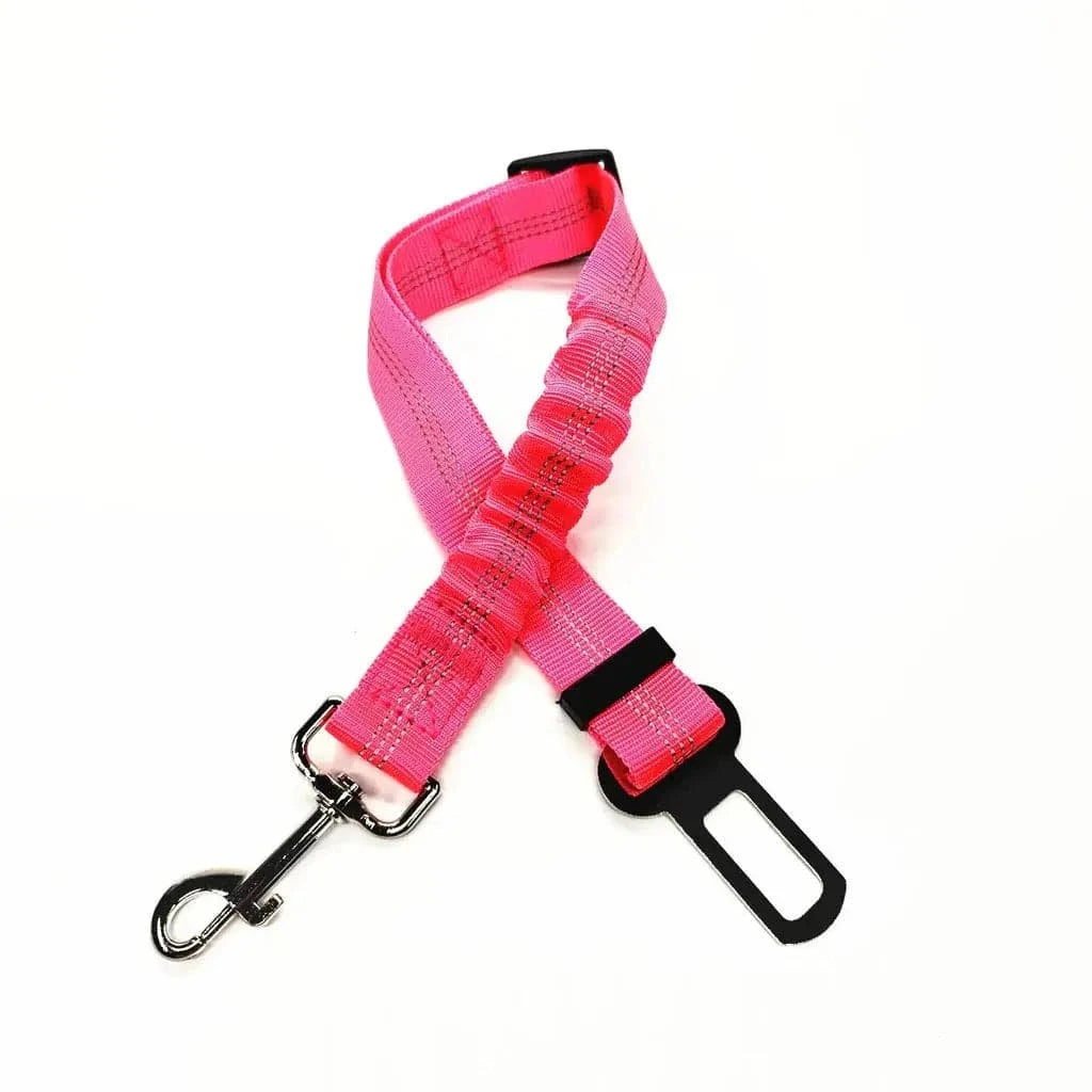 Hot pink bungee dog seat belt laid flat, showing the braided strap, sliding buckle and swivel hook