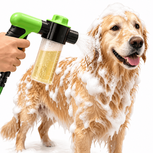 Hand holding the dog washing hose attachment with a shampoo-filled dispenser beside a lathered golden retriever.