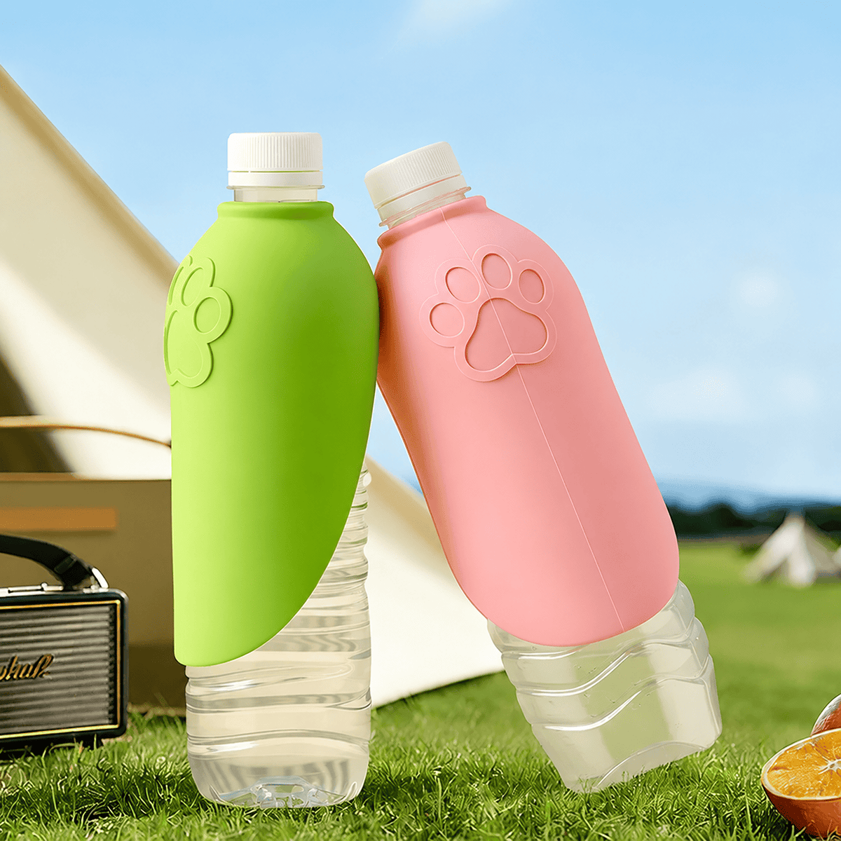 The green and pink Noblias water bottle attachments shown side by side on two bottles.