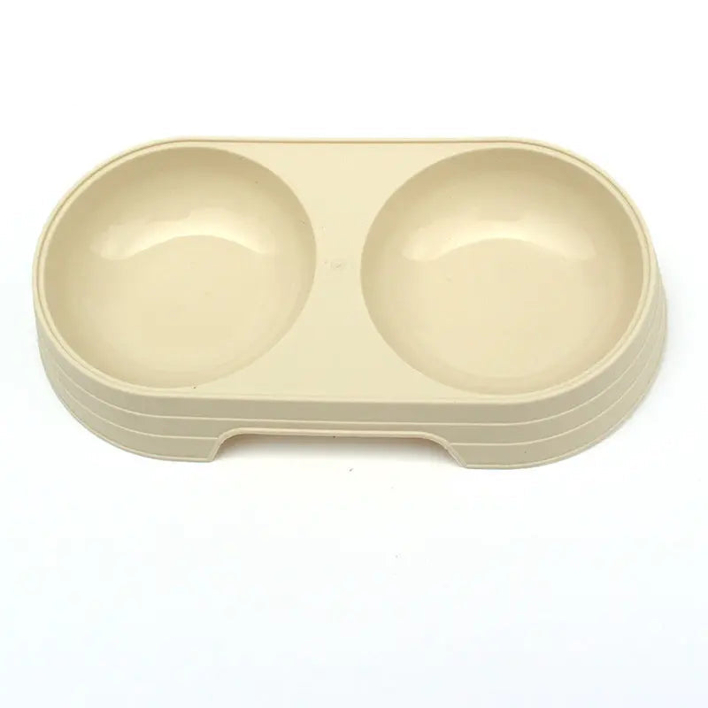 The cream yellow double pet bowl set shown on its own from above