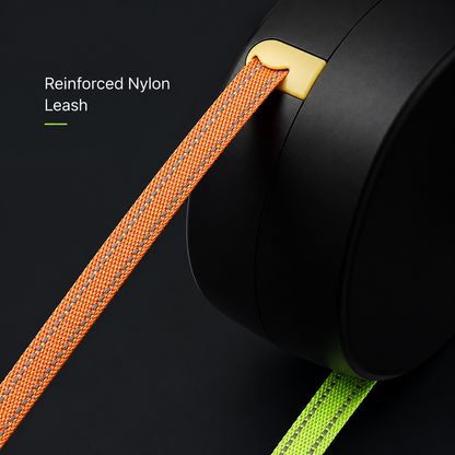 Orange and green reinforced nylon lines running into the black housing of the dual retractable dog leash.
