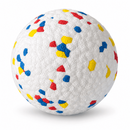 White durable dog chew ball with red, blue and yellow speckles on a white background.