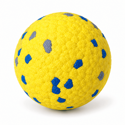 Yellow durable dog chew ball with blue and grey speckles on a white background.
