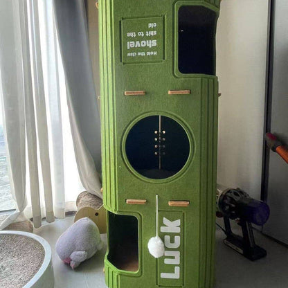 The three layer Noblias felt cat house standing by a window in a living room.